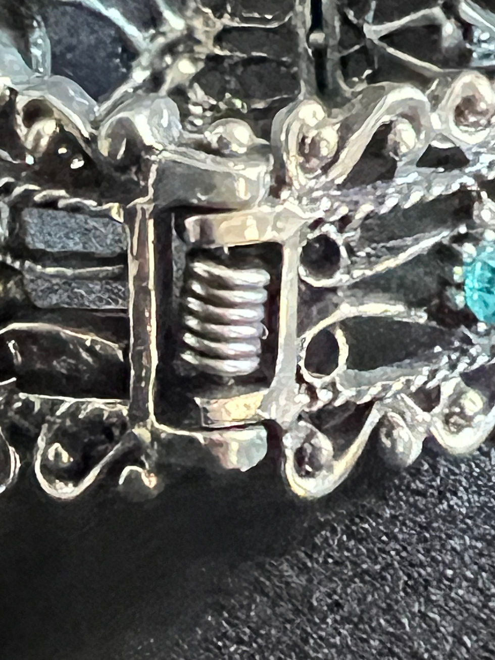 Thumbnail: Aqua and Clear Rhinestones in a Silver Crafted Flower setting