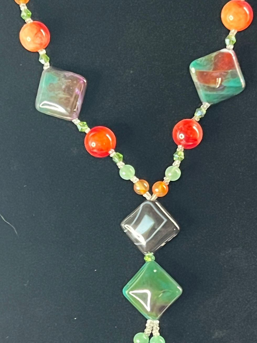 Thumbnail: Orange and Jade green Glass and Ceramic Beaded Necklace close up
