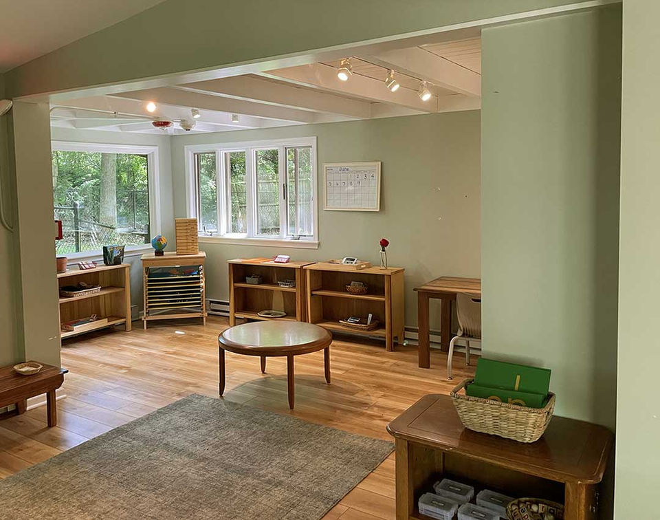 Beautiful interior shot of our cozy schoolhouse with toys displayed ready for learners,