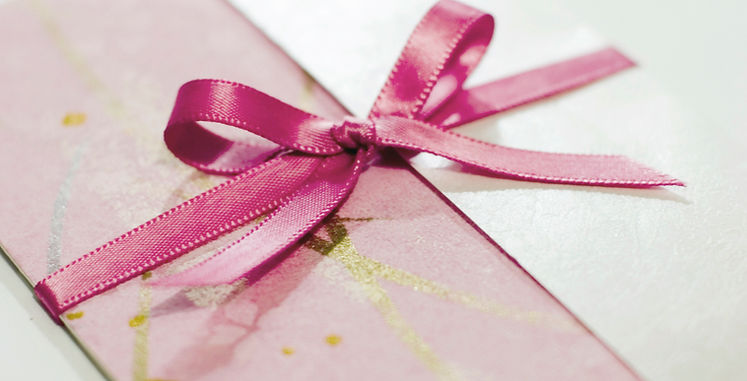 Practical wedding invitation wording examples covering traditional, modern, and blended-family hosting situations, along with formatting and etiquette guidance.