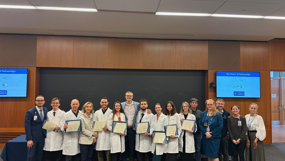 Six Ukrainian doctors with Yale School of Medicine faculty holding certificates after completing one-month pain management observership through Ukraine Without Pain initiative