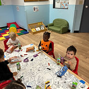 Toddlers doing hands-on daycare activities at Bright Minds Children Academy in Aurora.