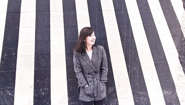 Danielle Moore Headshot BW Stripes.webp