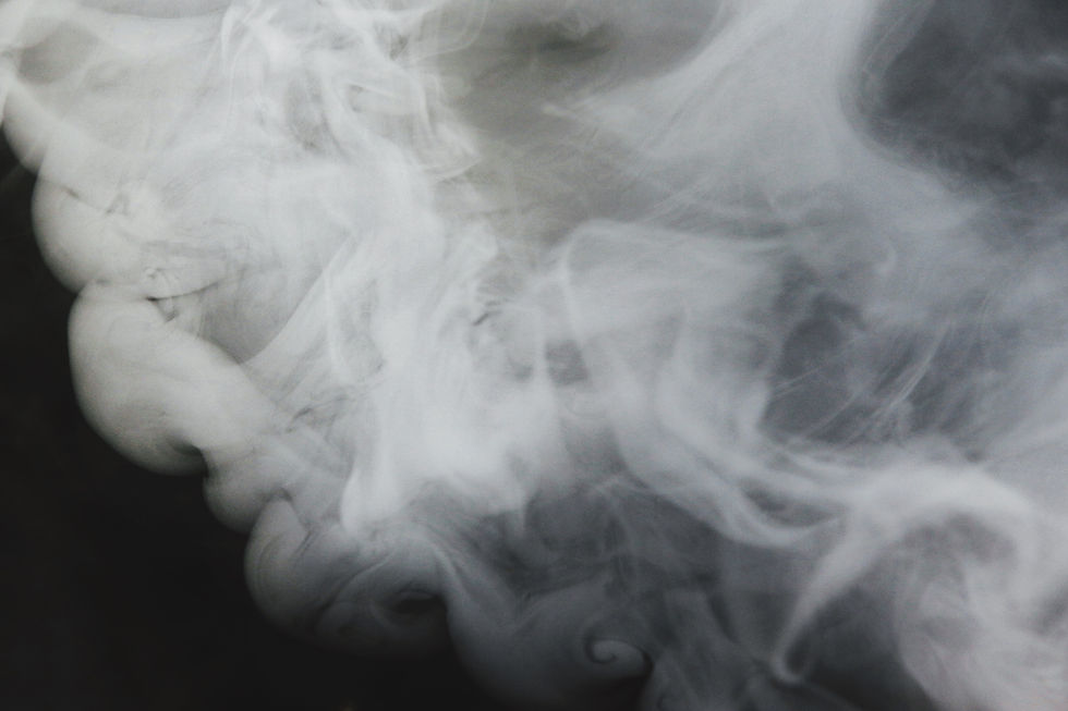 a-white-smoke-flowing-over-water-2BL5CER