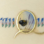 Tranquil written in calligraphy with 23k gold leaf and watercolor on calfskin. Miniature painting of butterfly.