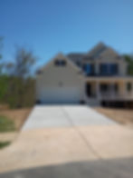 Modern home with a new quality concrete driveway.
