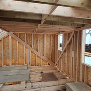 Inside view of timber framed dormer construction, with windows