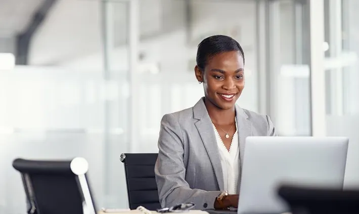 picture of a lady working on her PC