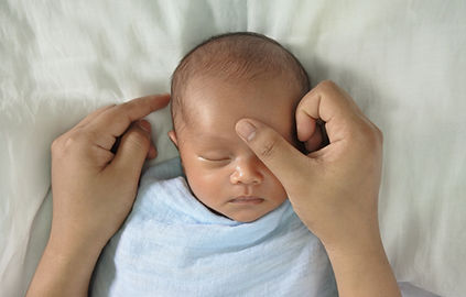 Baby receiving craniosacral therapy