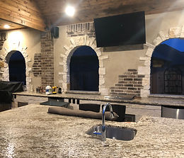 Italian styled outdoor living area in Montgomery Tx by DreamLife Custom Pools 77316