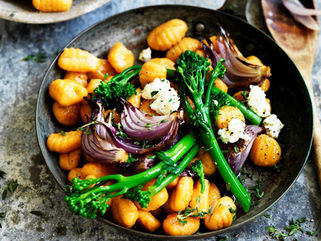 Pumpkin gnocchi with broccolini and red onion