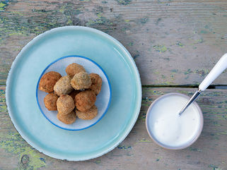 Deep-fried stuffed olives with ouzo dip