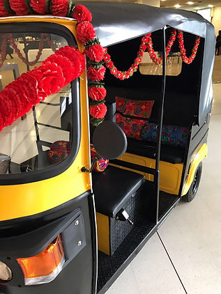 Authentic Tuk Tuk/Rickshaw which has some great decor on it. It includes bright garlands and india style cushions.