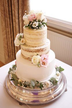 Semi-naked wedding cake with fondant