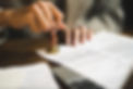 Signed paperwork being validated b a government authority for notarization