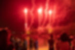 red fireworks viewed from sentosa beach