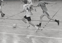 Kids playing indoor soccer