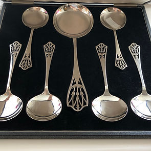 A Silver Dessert Set With A Pierced Tulip Pattern Sheffield 1947.