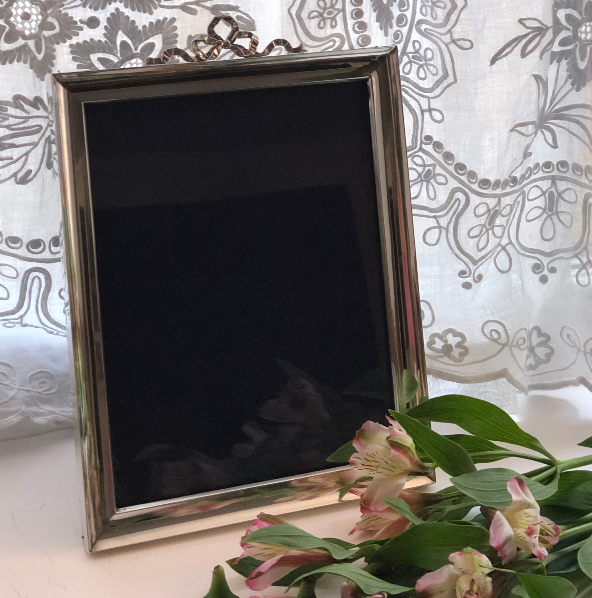 A Silver Picture Frame With A Bow Design London 1906.