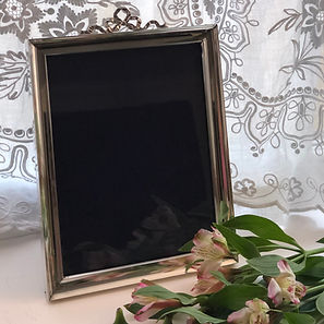 A Silver Picture Frame With A Bow Design London 1906.