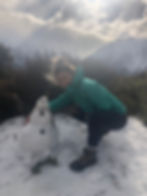 Woman Hiker With Snowman At The Summit Of Red Tarns Hiking Track In Mount Cook