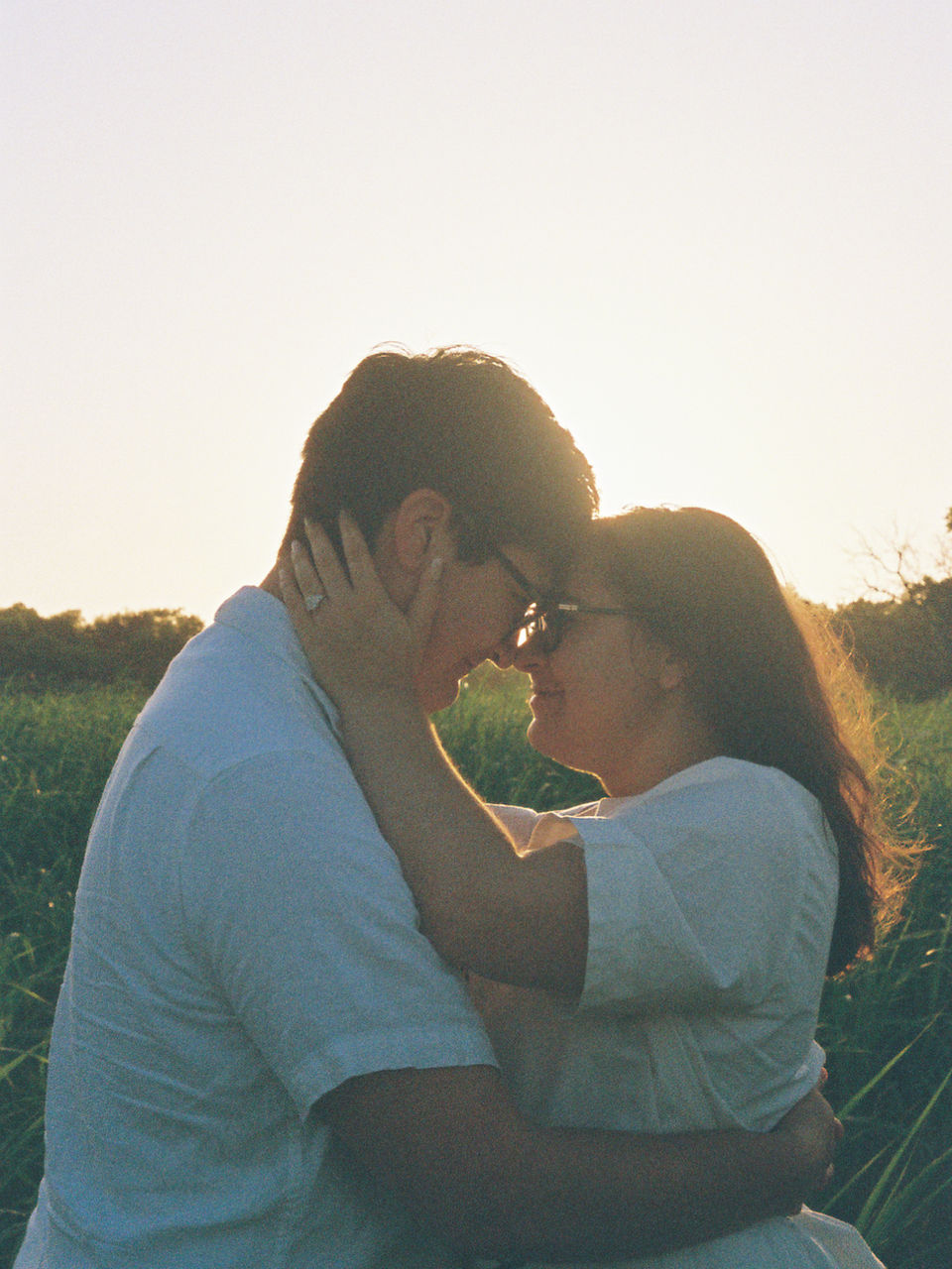 couple hugging with foreheads together