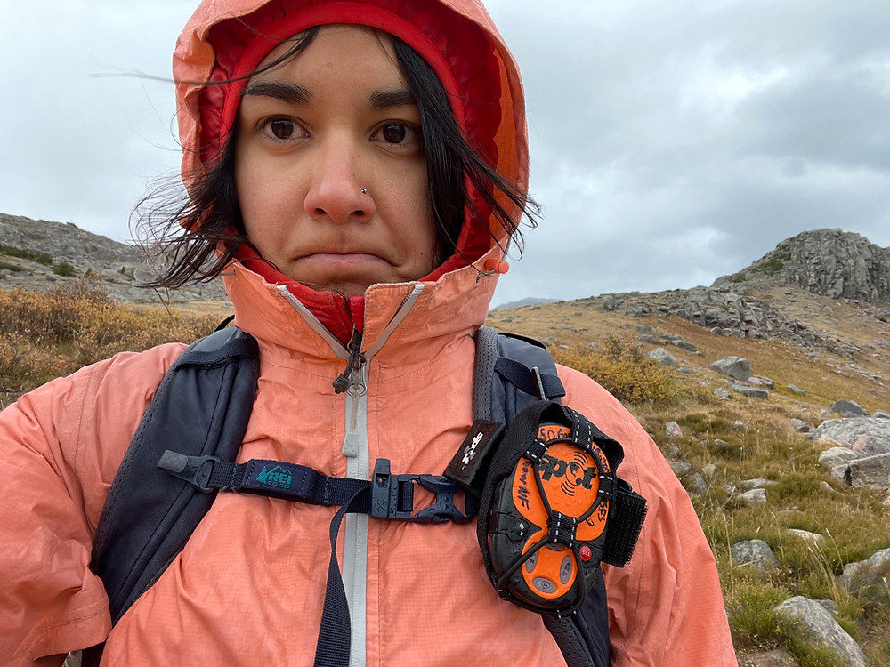 Woman in raincoat hiking