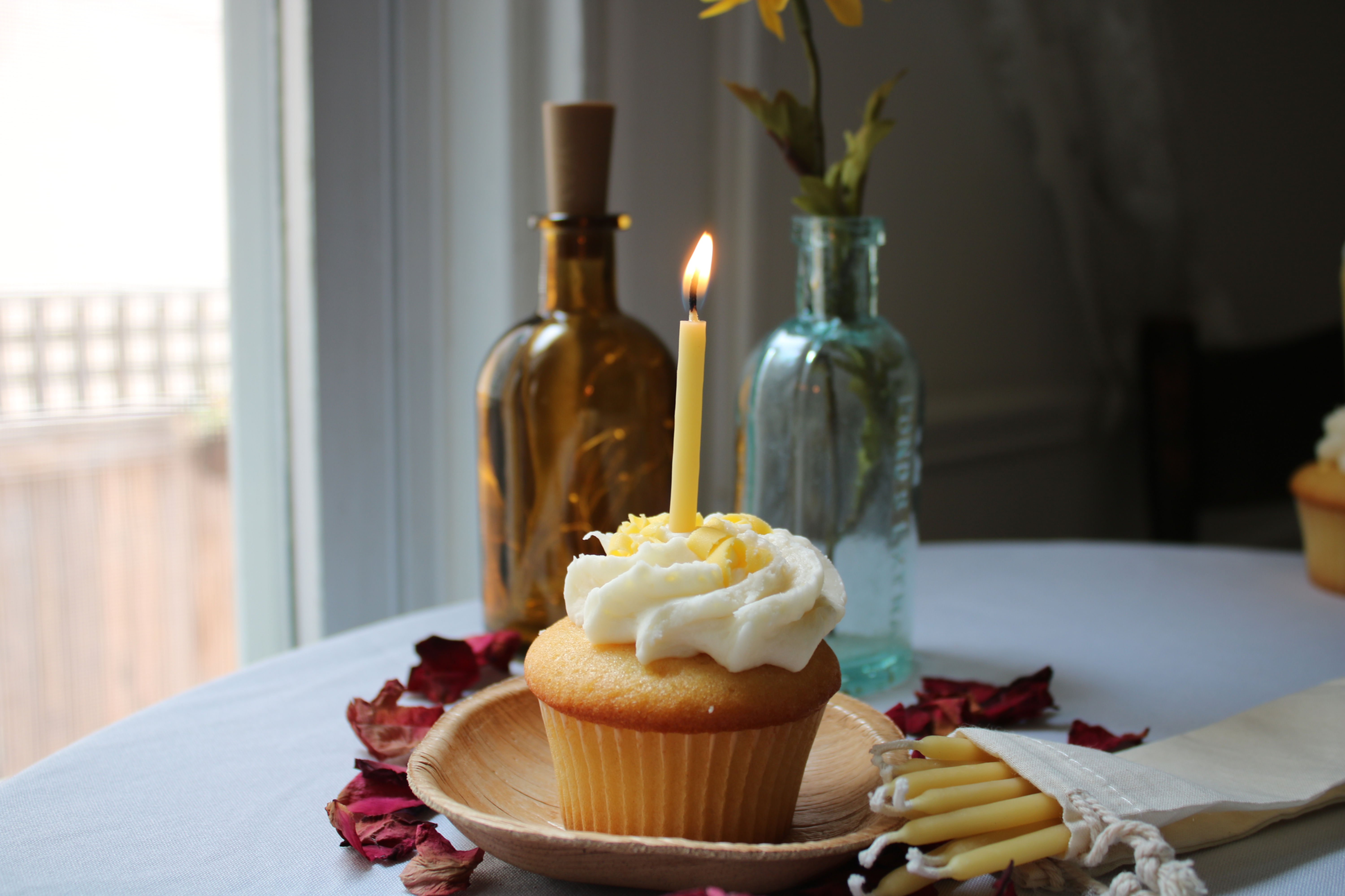 Beeswax Birthday candle on a vanilla cupcake