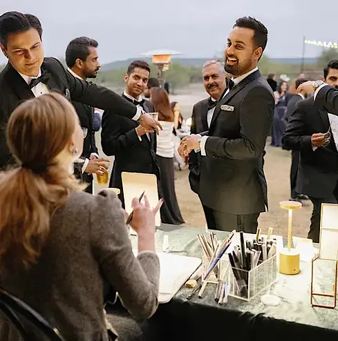 Live on-the-spot fashion illustration at a Dallas wedding — custom hand-drawn artwork created for guests in minutes