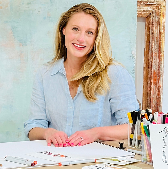 artist for dallas fashion artist sitting and posing  behind a desk