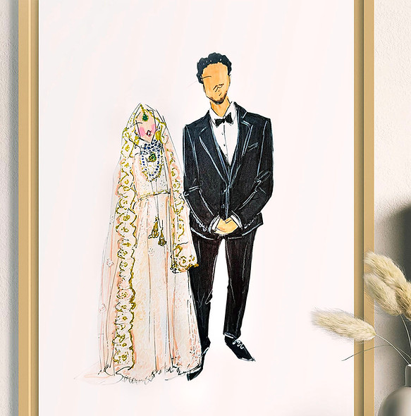 Framed custom drawing of a bride in an ornate white and gold dress beside a groom in a black tuxedo displayed on a white surface—perfect as a personalized gift.