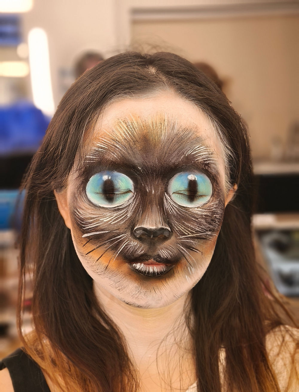 Person with Siamese cat face filter