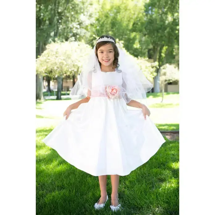 Thumbnail: flower girl twirling in a flower girl dress