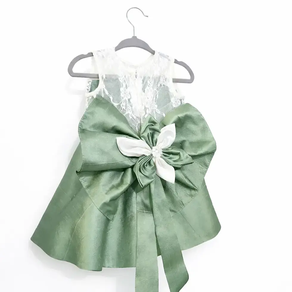 Thumbnail: close up view of large double bow on sage green dress