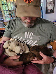 Byron holding rescued beaver t Holly's Nest