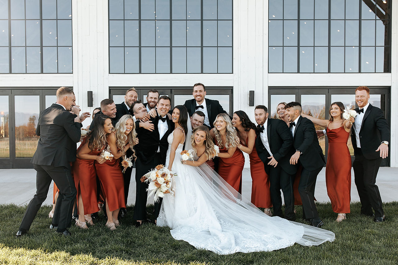wedding party having fun with bride and groom