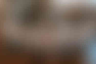 bride and bridesmaids getting ready in barn