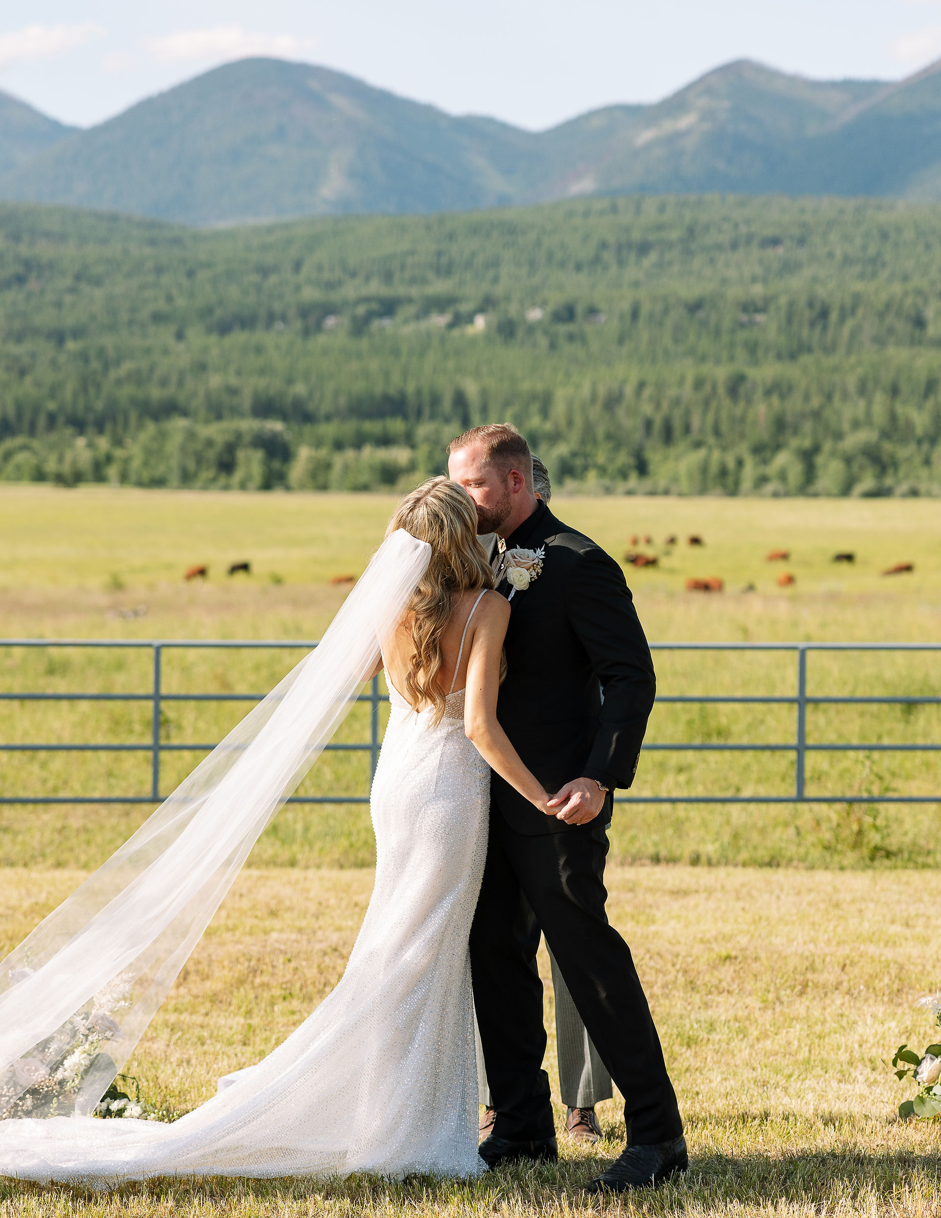 bride and groom first kiss during wedding ceremony