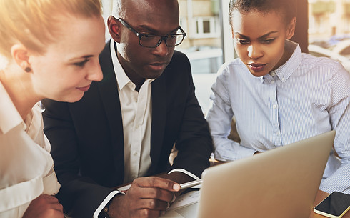 People look at a laptop
