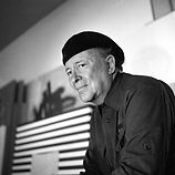 artist wearing a black cap