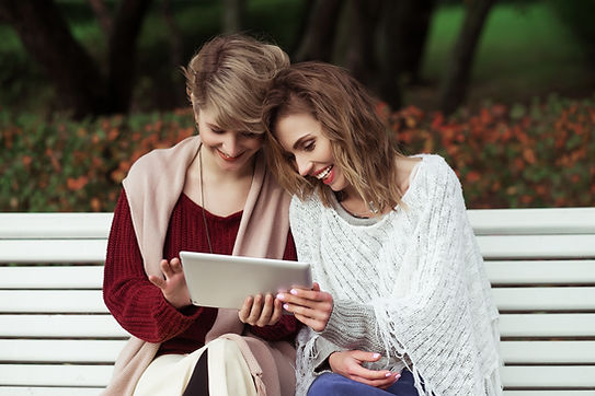 beautiful-women-girls-autumn-using-tablet-outdoor (1).jpg