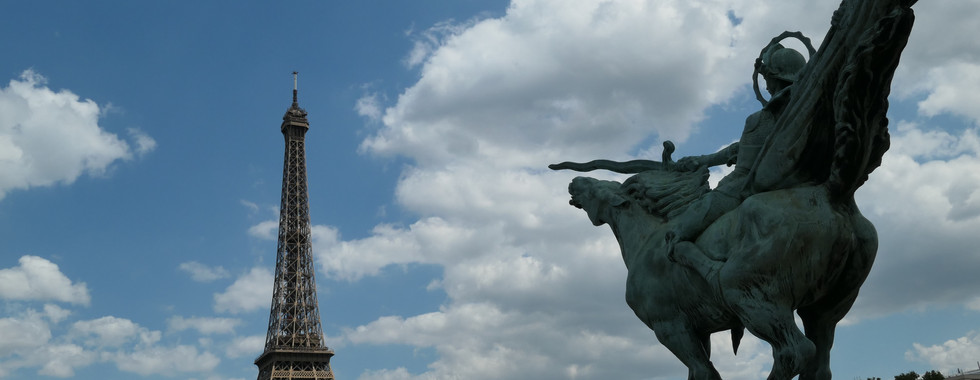 The equestrian statue called Monument de la France Renaissante with the Eiffel Tower in the background.