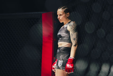 MMA fighter in cage preparing for fight