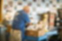 Volunteer working on filling food bank boxes
