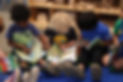 Kids reading books sitting on the floor