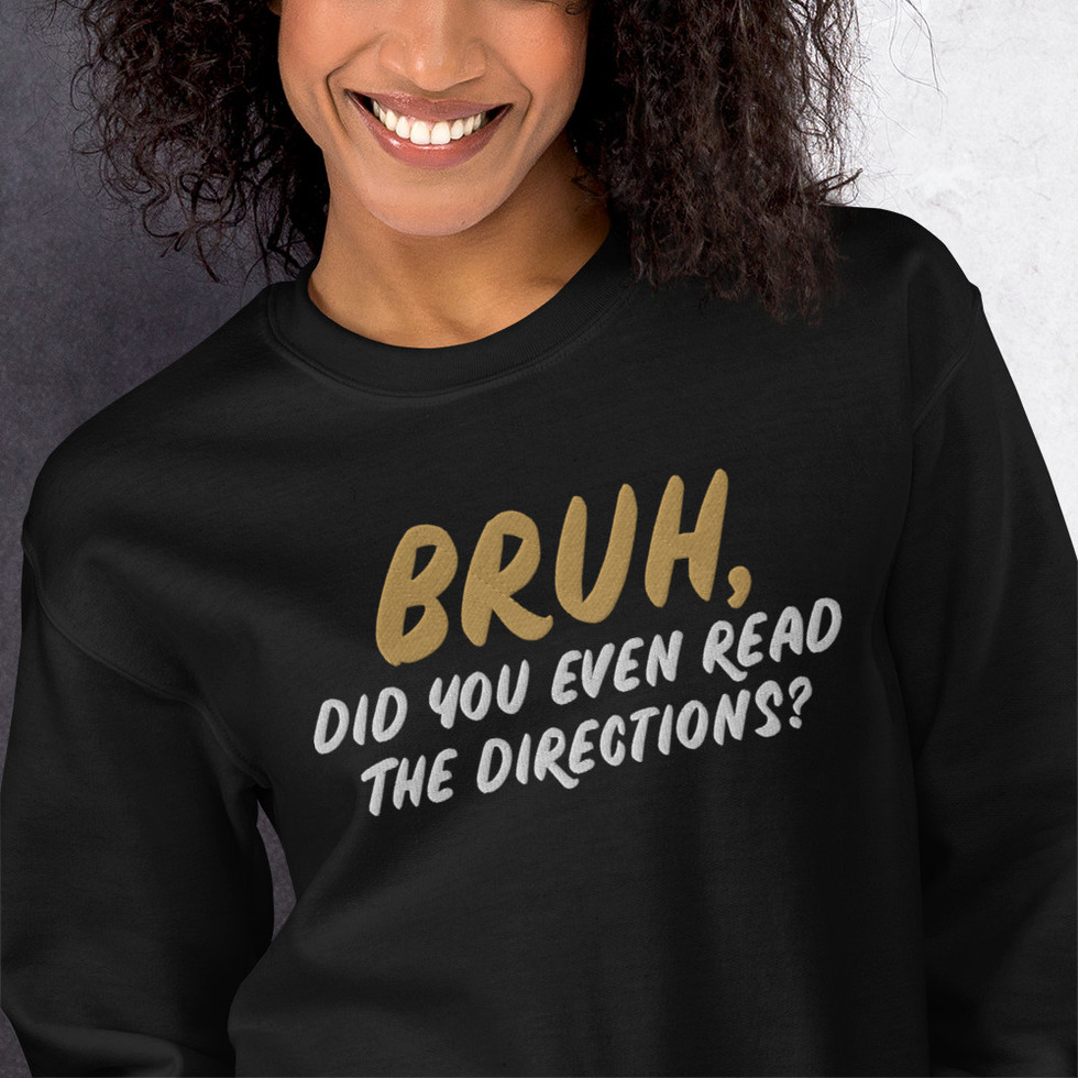 Close up of woman wearing black embroidered sweatshirt reading "Bruh, did you even read the directions?"