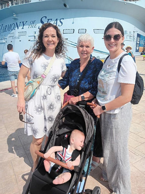 Four generations photo in front of a ship