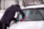 Man clearing snow from your car