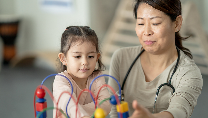 doctor-with-child-developmenal-monitoring.png