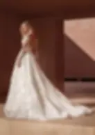front view lace ball gown with a low open back and long fitted lace sleeves